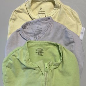 Three solid newborn swaddles.